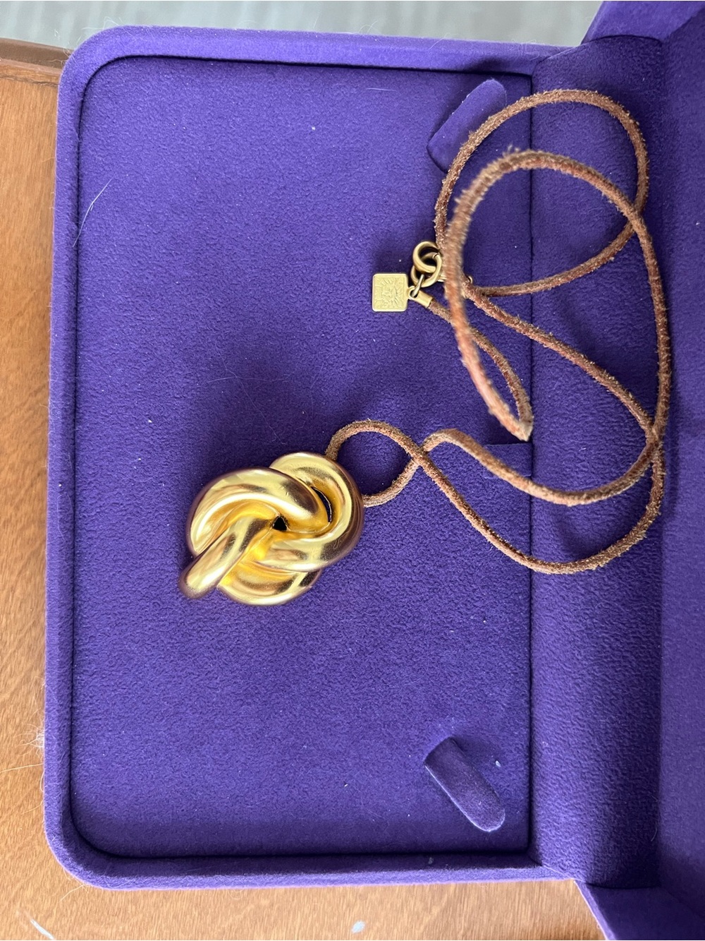 Anne Klein Gold Knot Pendant on Brown Suede Cord